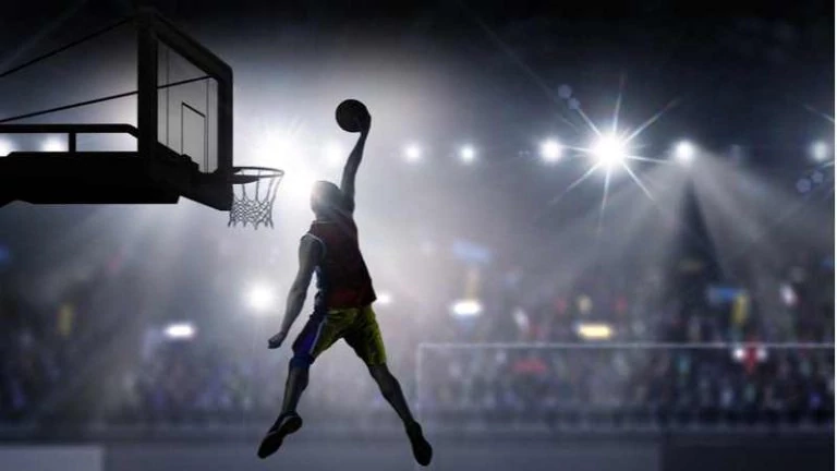 Basketball player dunking in a hoop