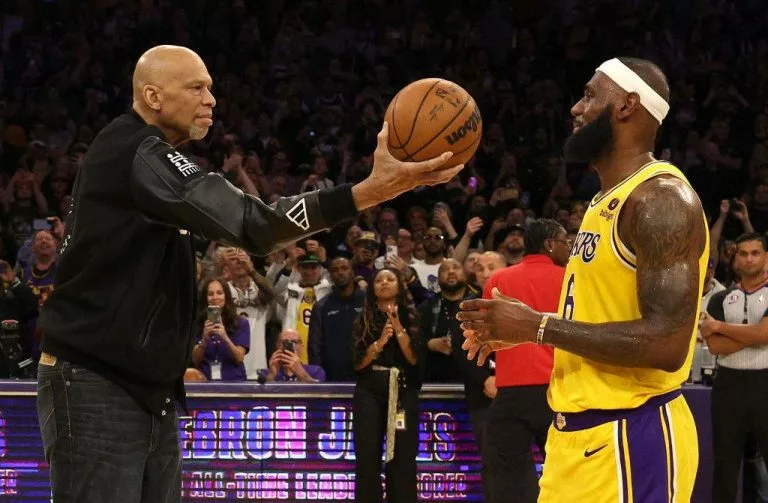 Kareem Abdul-Jabbar ceremoniously hands LeBron James